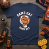 Navy blue t-shirt with "GAME DAY GAME DAY" text and an orange fist inside a soccer ball graphic