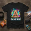Black t-shirt with "GAME ON!" text and a capybara wearing headphones and holding a game controller