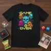 Black t-shirt with "GAME OVER" text and multiple colorful skull graphics in a retro pixel art style