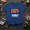 Retro "Game Over Start Again Yes No" pixelated video game design on a blue t-shirt