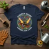 Garden More Complain Less quote on a navy t-shirt with a circular floral garden graphic and hands planting
