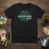 Gardening Guru T-Shirt with circular floral and plant design. Features text "Gardening Guru" in white