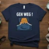Navy t-shirt with white text "GEH WEG !" and a grumpy orange cat lying in bed under a blue blanket