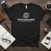 Black t-shirt with white text "Genesis Institute Academy Coaching and Mentoring" and globe graphic