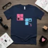 Geometric Heart Connection T-Shirt featuring abstract pink and blue squares, circle, triangle, and heart symbols connected by dotted lines