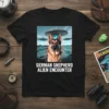 German Shepherd dog with three UFOs in an alien landscape, text reads "GERMAN SHEPHERD ALIEN ENCOUNTER" on a black t-shirt