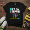 Black t-shirt with "GET DA STEPPIN'" in retro turquoise and white text, featuring cartoon legs in sneakers mid-stride