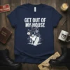Navy blue t-shirt with white text "GET OUT OF MY HOUSE" above a cartoon haunted house with a ghost and