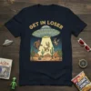 Get In Loser t-shirt with Bigfoot, deer, and a bat-like creature being abducted by a UFO in a desert landscape
