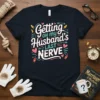 Getting ON my Husband's LAST NERVE quote on a navy t-shirt, featuring playful typography and decorative elements like hearts and