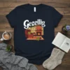 Gezellig t-shirt design featuring a cozy living room scene with a fireplace, armchair, and coffee cup, plus the word "Gezellig"