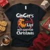 Gingers ARE FOR Life NOT JUST FOR Christmas text with gingerbread man graphic wearing Santa hat, on a black t-shirt