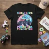 Girls Like Monster Trucks Too text design with a cute unicorn monster truck graphic, pastel colors, and playful flowers