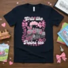 Girls Like Trains Too text with a pink bow-adorned train graphic on a navy t-shirt