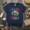 Girls Trip Bali 2026 t-shirt with sunset, palm trees, and four friends walking on a beach design