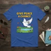 T-shirt with "GIVE PEACE A CHANCE" text above a dove holding an olive branch and a peace symbol on its