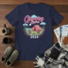 Glamping Squad 2024 t-shirt design featuring a pink tent, campfire, chairs, and lake under a starry sky