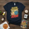 Gluten Tolerant Boom t-shirt design featuring a flexing arm and shield with wheat symbol