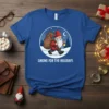 Gnome For The Holidays t-shirt with a cartoon gnome carrying a gift sack and lantern in a snowy scene