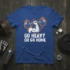 Go Heavy Or Go Home motivational quote t-shirt with a muscular arm lifting a barbell surrounded by flames