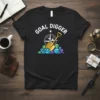 GOAL DIGGER text with shovel and gems graphic on a black t-shirt