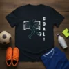T-shirt design with the text "GOAL!" and a graphic of a soccer player kicking the ball into a net