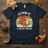 Gobble I Mean Meow text with a cute cat dressed as a turkey on a dark t-shirt