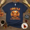 Funny Thanksgiving turkey wearing a chef hat and lifting dumbbells, with text "Gobble Til You Wobble" on a navy t-shirt