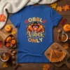 Gobble Vibes Only Thanksgiving t-shirt with a cartoon turkey wearing a pilgrim hat and fall leaves