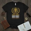 Black t-shirt with "GOD FIRST GOD FIRST GOD FIRST GOD FIRST" text and a golden lion head emblem