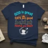 T-shirt with "GOD is great CATS are good PEOPLE are CRAZY" text, featuring three black cats and a distressed person