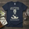 Navy blue t-shirt with white text "God Is Within Her She Will Not Fall Psalm 46:5" and a silhouette of