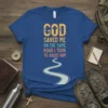GOD SAVED ME ON THE SAME ROAD I TOOK TO AVOID HIM quote on a blue t-shirt with a winding