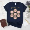 Navy t-shirt with "God Says I Am" and circular affirmations: valued, protected, loved, strong, chosen, unique, important, with Bible verses