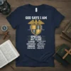 Navy t-shirt with "God Says I Am Chosen" text, scripture references, and a shield graphic with an eagle