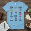 Light blue t-shirt with "God Says I Am" and nine illustrated affirmations including Important, Chosen, Strong, Special, Not Alone, Loved