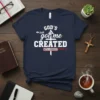 Christian t-shirt with "God's Got Me Created With A Purpose" text and Ephesians 2:10 reference, featuring a cross graphic