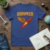 Godspeed text above a red rocket ship with wings and fiery exhaust on a blue t-shirt