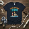Going Boating Oh Buoy Oh Buoy text with lighthouse, sailboat, and buoy graphic on navy t-shirt