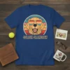 Golden Grandpaw t-shirt featuring a cool Golden Retriever wearing sunglasses with a retro sunset background and text "GOLDEN GRANDPAW"