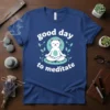 Good Day To Meditate text with a meditating white cat graphic surrounded by leaves on a blue t-shirt