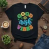 Black t-shirt with colorful "GOOD irish VIBES" text and shamrock graphic, perfect for St. Patrick's Day