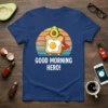 Good Morning Hero! text with a cute avocado and fried egg character wearing a cape, on a navy t-shirt