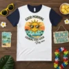 T-shirt with "Good Morning Looking Very Good Very Nice" text and a smiling sun wearing sunglasses at the beach