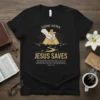 Christian t-shirt with "GOOD NEWS JESUS SAVES" and John 3:16 scripture, featuring a hand holding a cross and a path