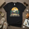 T-shirt with "GOOD VIBES & BIKE RIDES" text and a seagull riding a bike at sunset