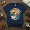 Shiba Inu dog riding a bicycle with "Good Vibes On Two Wheels Adventure Awaits" text, sunset and waves graphic