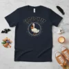 Navy blue t-shirt with "GOOSE SHEET" text and a goose holding a pumpkin, surrounded by bats and hearts