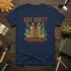 Got Dirt? t-shirt design featuring brown gardening boots, green leaves, worms, a trowel, and a watering can