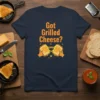 Got Grilled Cheese? text with illustration of two hands pulling apart a gooey grilled cheese sandwich on a navy t-shirt